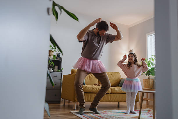 istock Little Daughter Teaching Father Ballet at Home 2250705502