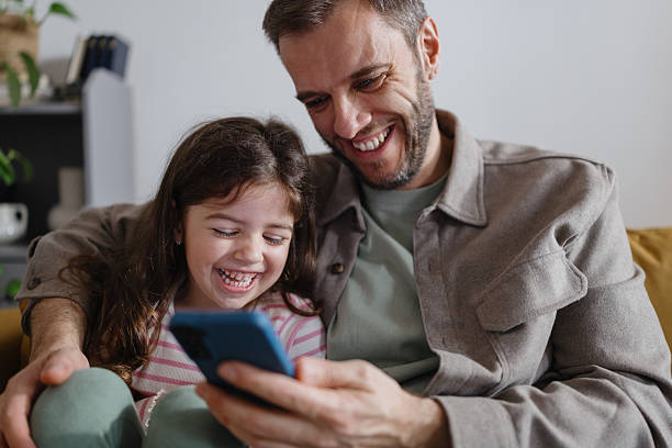 istock Dad and Daughter Bonding Over Smartphone at Home 2250706397