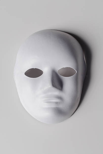 istock White mask on a plain background showcasing simplicity and anonymity in design 2250707926