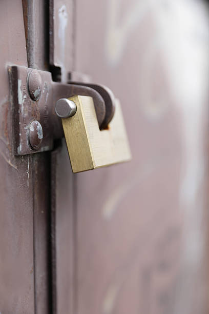 istock Metal Latch Left Open On Urban Door 2250708042