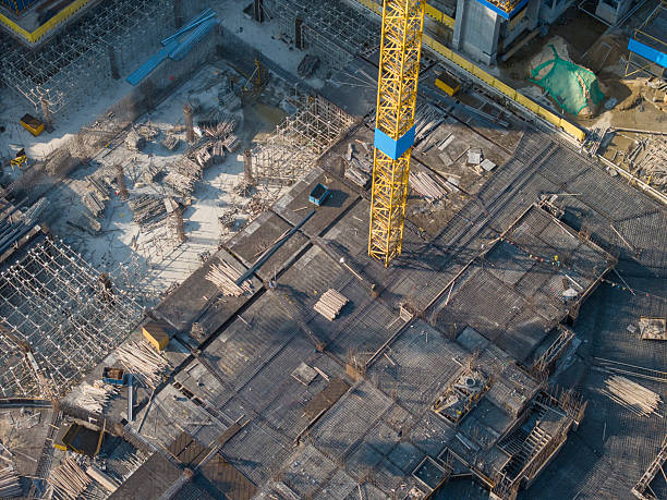 istock Aerial View of Construction Site with Tower Crane 2250709312