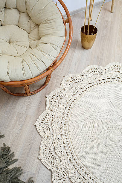 istock Cute homemade thick thread knitting pattern made by hand: handmade beige thread rug, woven pattern, rustic traditions, knitting art 2250713339