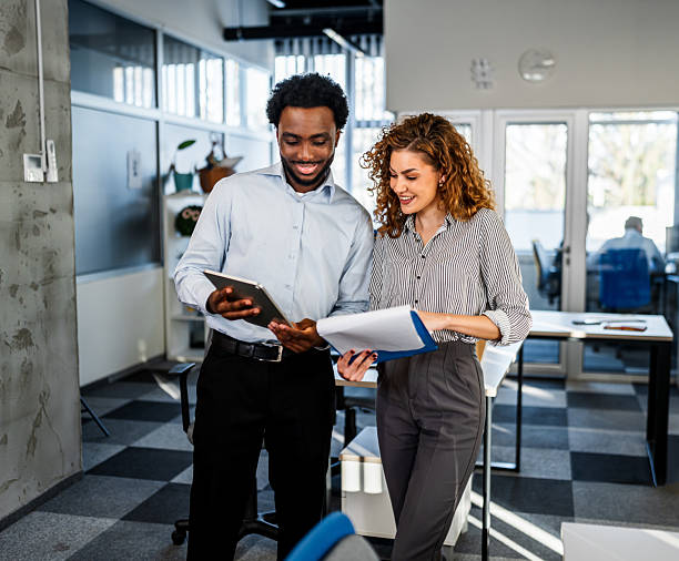 istock Business colleagues collaborating on project in modern office 2250720969