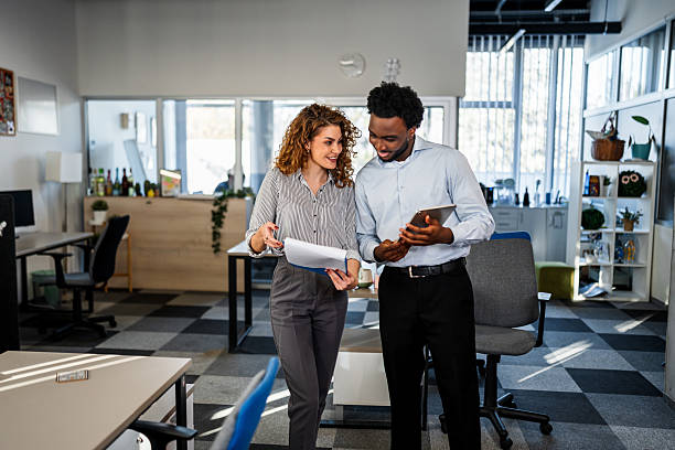 istock Business colleagues collaborating on strategy in modern office 2250721379