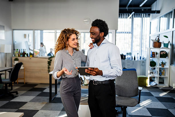 istock Business colleagues collaborating on tablet in modern office 2250721446