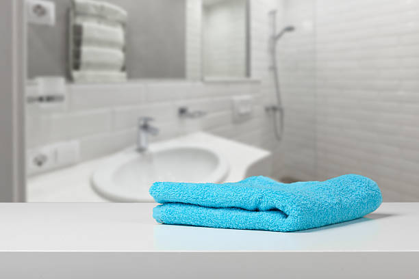 istock Bright blue towel rests on a clean white surface in a modern bathroom setting 2250721863