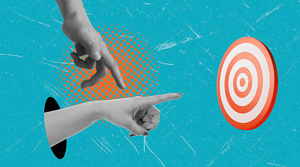 istock Art collage, Hands point towards a target on a vibrant blue background during an abstract art session 2250724999