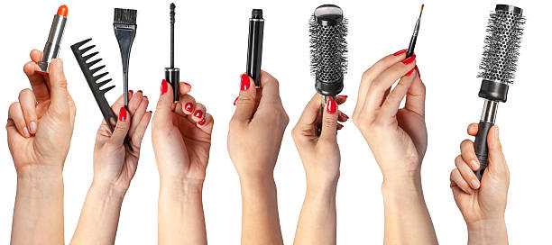 istock Hands display various beauty tools for hair styling and makeup application 2250727788