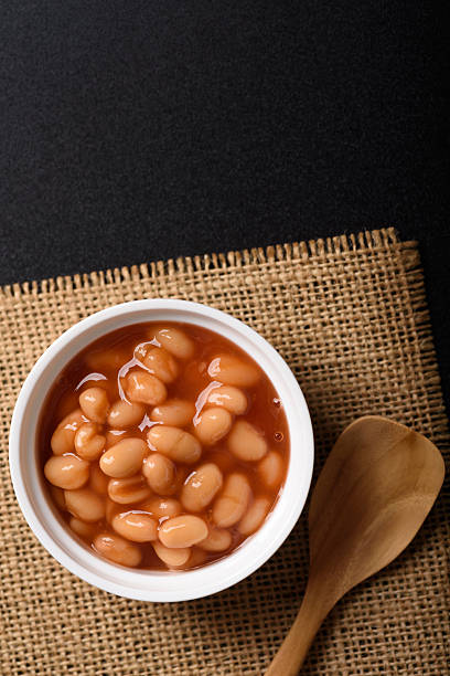 istock Baked beans from canned food on black background 2250729963