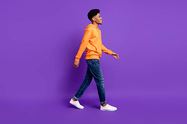 istock Full length body size profile side view of attractive cheerful guy strolling isolated over bright violet purple color background 2250730273