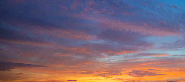 istock Clouds and sky at sunrise and sunset,Clouds and sky at sunrise and sunset,Sunset sky clouds in the evening with Orange gold sunlight in golden hour, Panoramic Horizon sky background 2250737396