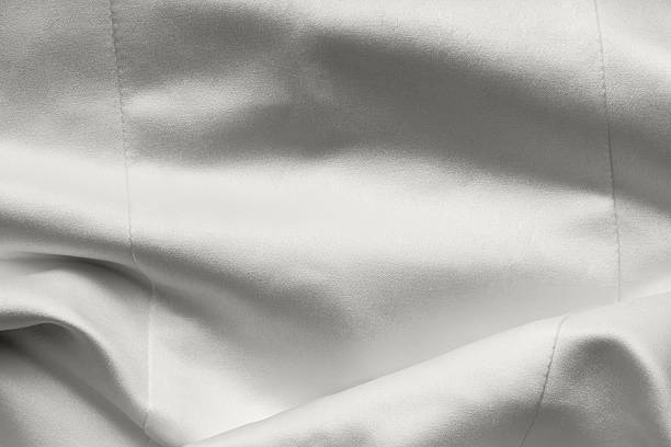 istock Cloud white dancer satin fabric. Bridal wedding dress textile background 2250740514