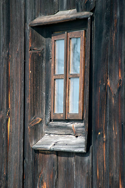 Wooden church. Architectural details. Probołowice, Poland. The wooden parish church of St. James the Apostle from 1759 and the wooden bell tower from the mid-19th century