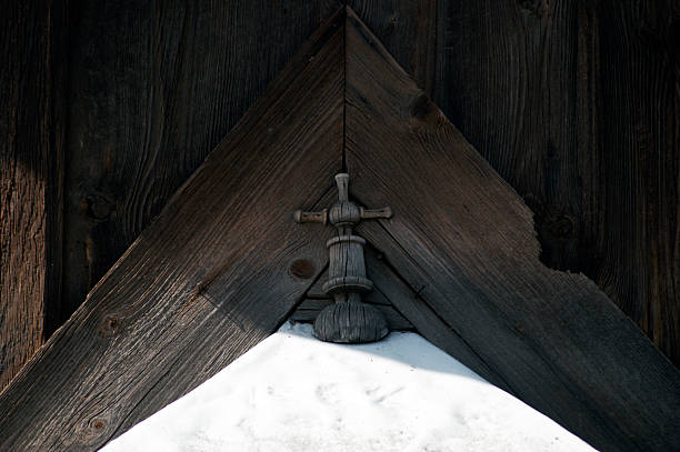 Wooden church. Architectural details. Probołowice, Poland. The wooden parish church of St. James the Apostle from 1759 and the wooden bell tower from the mid-19th century