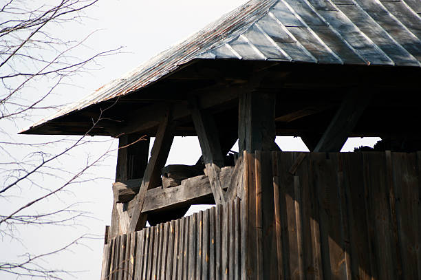 Wooden church. Architectural details. Probołowice, Poland. The wooden parish church of St. James the Apostle from 1759 and the wooden bell tower from the mid-19th century