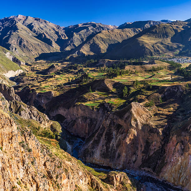 XXXXL size - this panoramic landscape is an very high resolution multi-frame composite and is suitable for large scale printing. Colca Canyon is a canyon of the Colca River in southern Peru. It is located about 100 miles (160 kilometers) northwest of Arequipa. It is more than twice as deep as the Grand Canyon in the United States at 4,160 m. However, the canyon's walls are not as vertical as those of the Grand Canyon. The Colca Valley is a colorful Andean valley with towns founded in Spanish Colonial times and formerly inhabited by the Collaguas and the Cabanas.