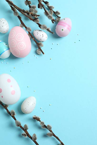 istock Colorful eggs, pussy willow branches, sweet sprinkles on a pastel blue background, space for text or advertising 2250742253
