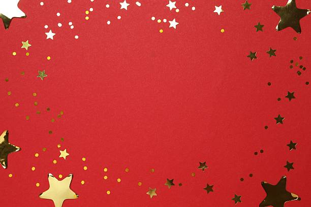 Christmas tree created with curled paper on red background