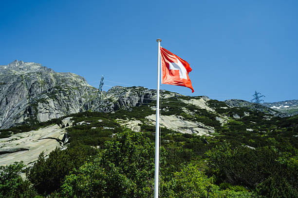 istock switzerland flag waving in the sky 2250744448