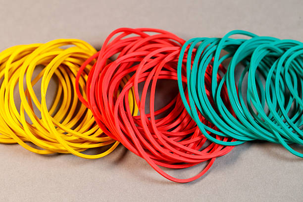 istock Colored rubber bands for money on a colored background. Stationery accessories 2250744614