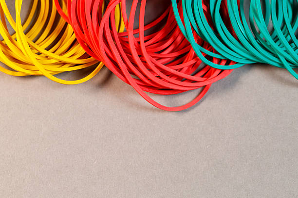 istock Colored rubber bands for money on a colored background. Stationery accessories 2250745012