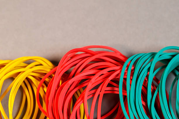 istock Colored rubber bands for money on a colored background. Stationery accessories 2250745307