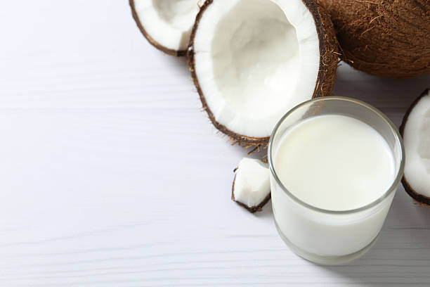 istock Glass of milk with coconuts on the table 2250745603