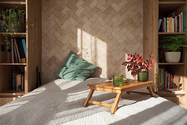A welcoming room with daylight, a breakfast tray, greenery, and small details that evoke relaxation and wellbeing.