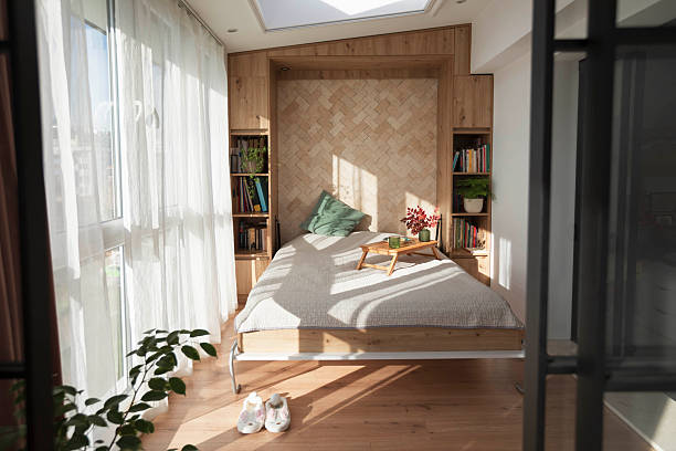 Minimalist bedroom. Bright room with natural textures and organized details. The atmosphere reflects clarity and balance.