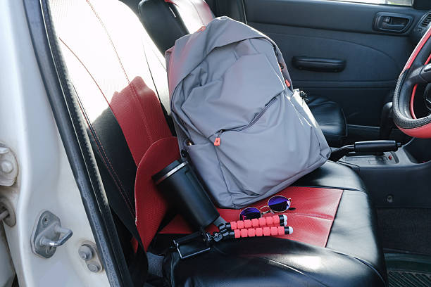 istock Car Interior with backpack, coffee cup, tripod and sunglasses 2250747204