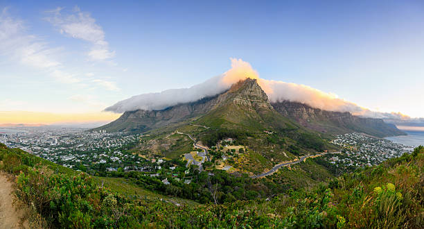 istock wide elevated panoramic view on Cape Town, table mountain and the Twelve Apostles at sunset 2250751744