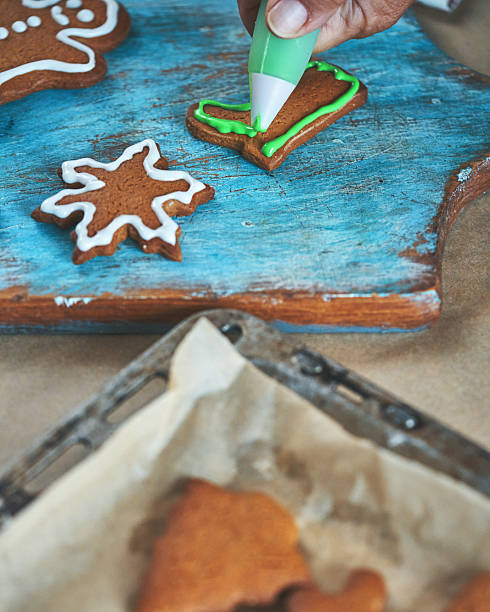 istock Decorating Gingerbread Christmas Cookies with Icing 2250752551