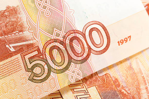 Detailed view of a 5000 ruble bill highlighting the artwork and serial number.