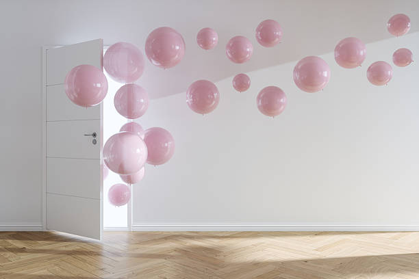 istock Pink Balloons Floating Through an Open Door 2250756330