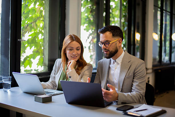 istock Business colleagues collaborating on laptop sharing ideas 2250756832