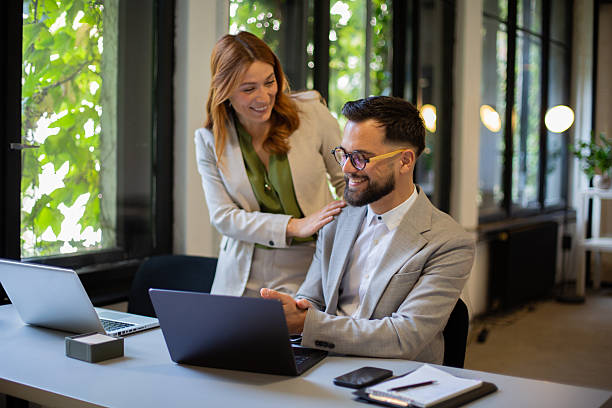 istock Business colleagues collaborating on laptop in modern office 2250757056