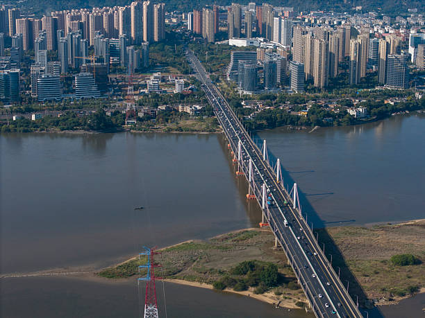 istock Aerial View of a Long Bridge Spanning a River 2250759196