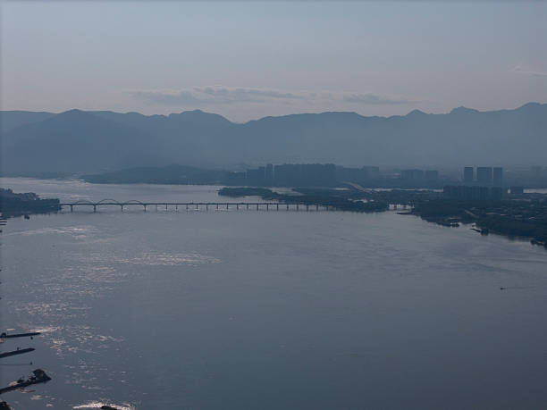 Aerial View of a Long Bridge Spanning a River