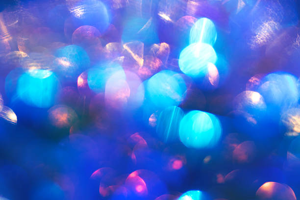 Soft, colorful blue bokeh scene with circular light orbs and dreamy glow.