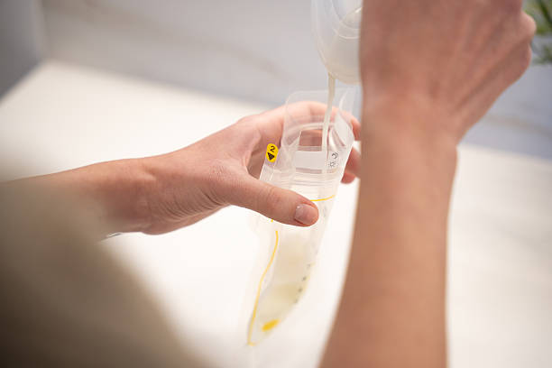 istock Breast milk being poured into a storage pouch for feeding 2250761132