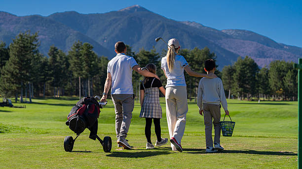 istock Family enjoying golf game on sunny day 2250767052