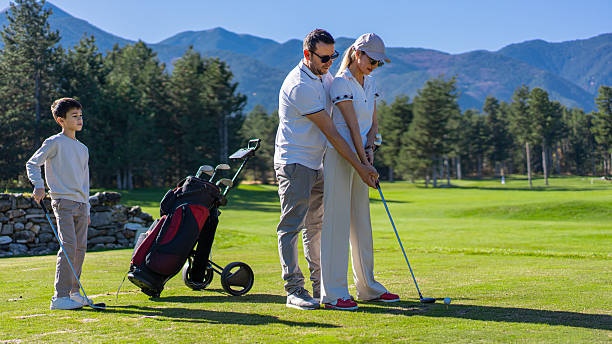 istock Family golf lesson on green during sunny day 2250767068