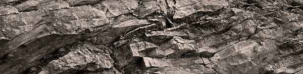 istock Light brown beige granite rock stone background. Mountain surface. Close-up. Cracked crumbled crashed destroyed weathered grunge. For design. Panoramic. 2250767539