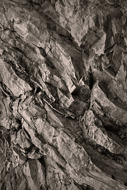 Light brown beige granite rock stone background. Mountain surface. Close-up. Cracked crumbled crashed destroyed weathered grunge. For design.