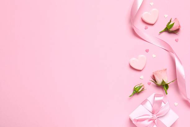 istock Beautiful composition with peony roses and gift box on color background 2250768438