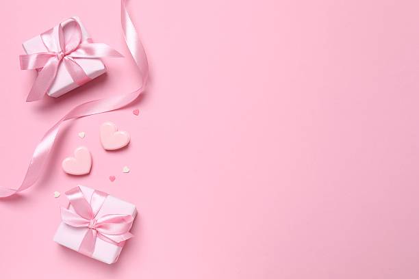 istock Beautiful gift boxes on color background 2250768479