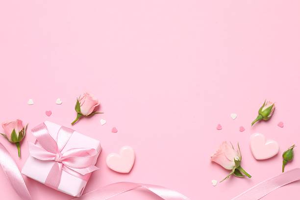 istock Beautiful composition with peony roses and gift box on color background 2250768534