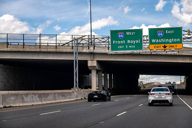 Front Royal, USA - May 24, 2025: Virginia interstate highway road 66 with overhead bridge exit for Washington DC with cars traffic