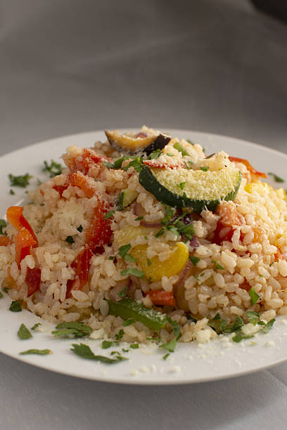istock Colorful vegetable rice salad with zucchini, bright bistro plate 2250772955