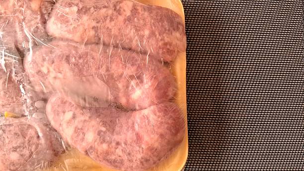 istock Sausage meat in a plastic bag 2250773668